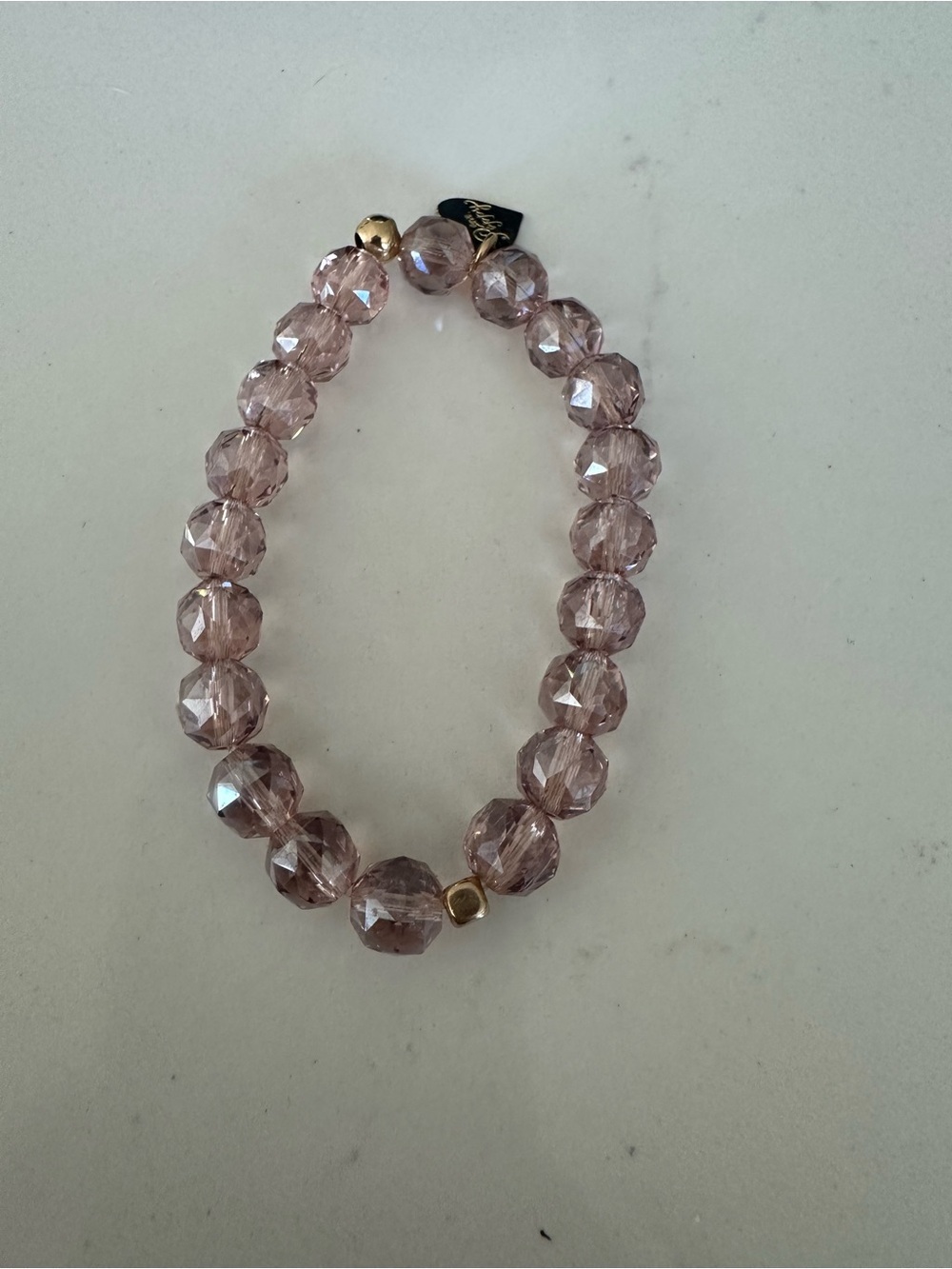 Faceted Light Pink Stretch Bracelet with Gold Accents